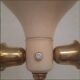 Tripod floor lamp – 1950s – wood and brass.