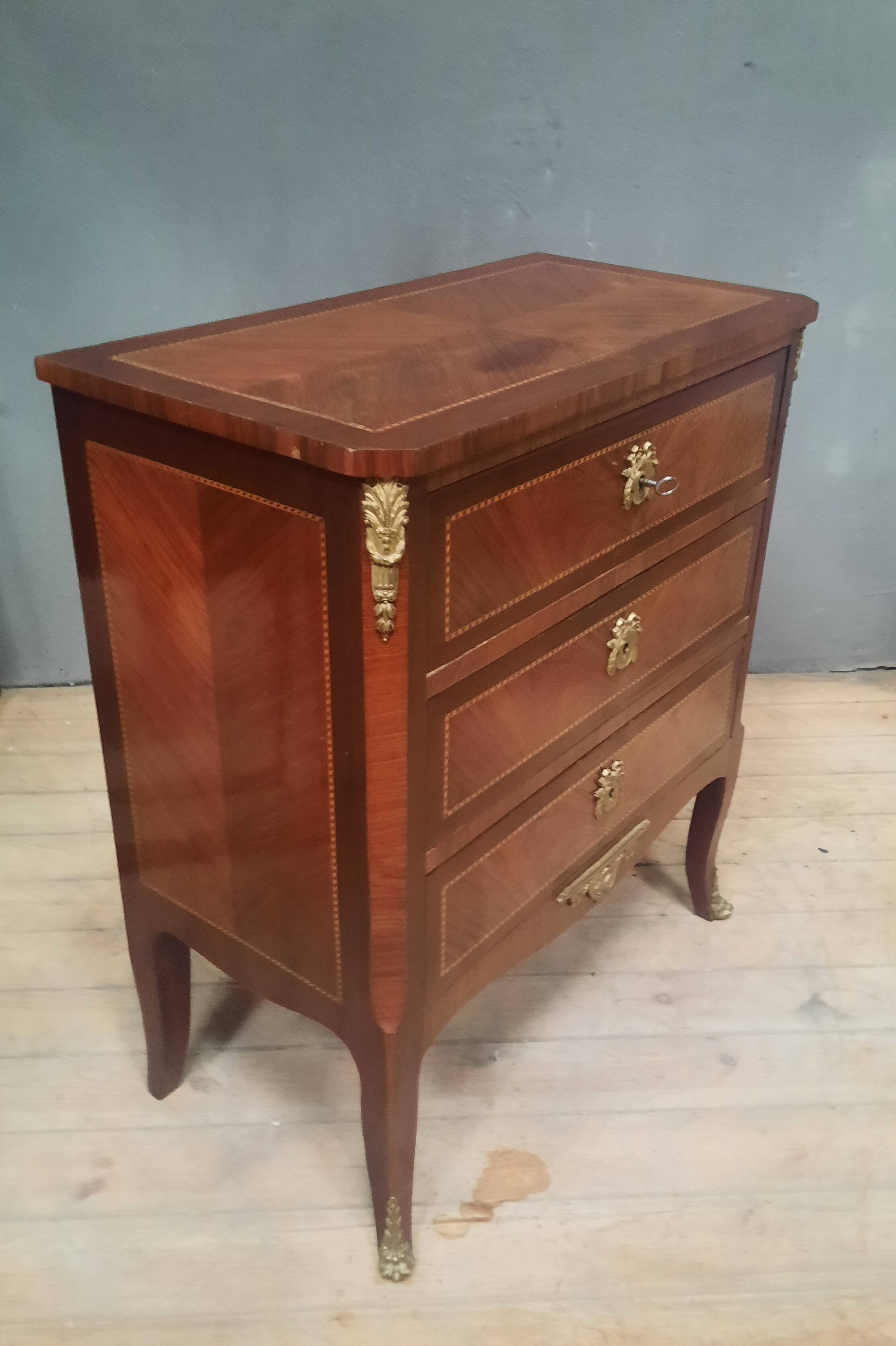 Small transitional style inlaid chest of drawers