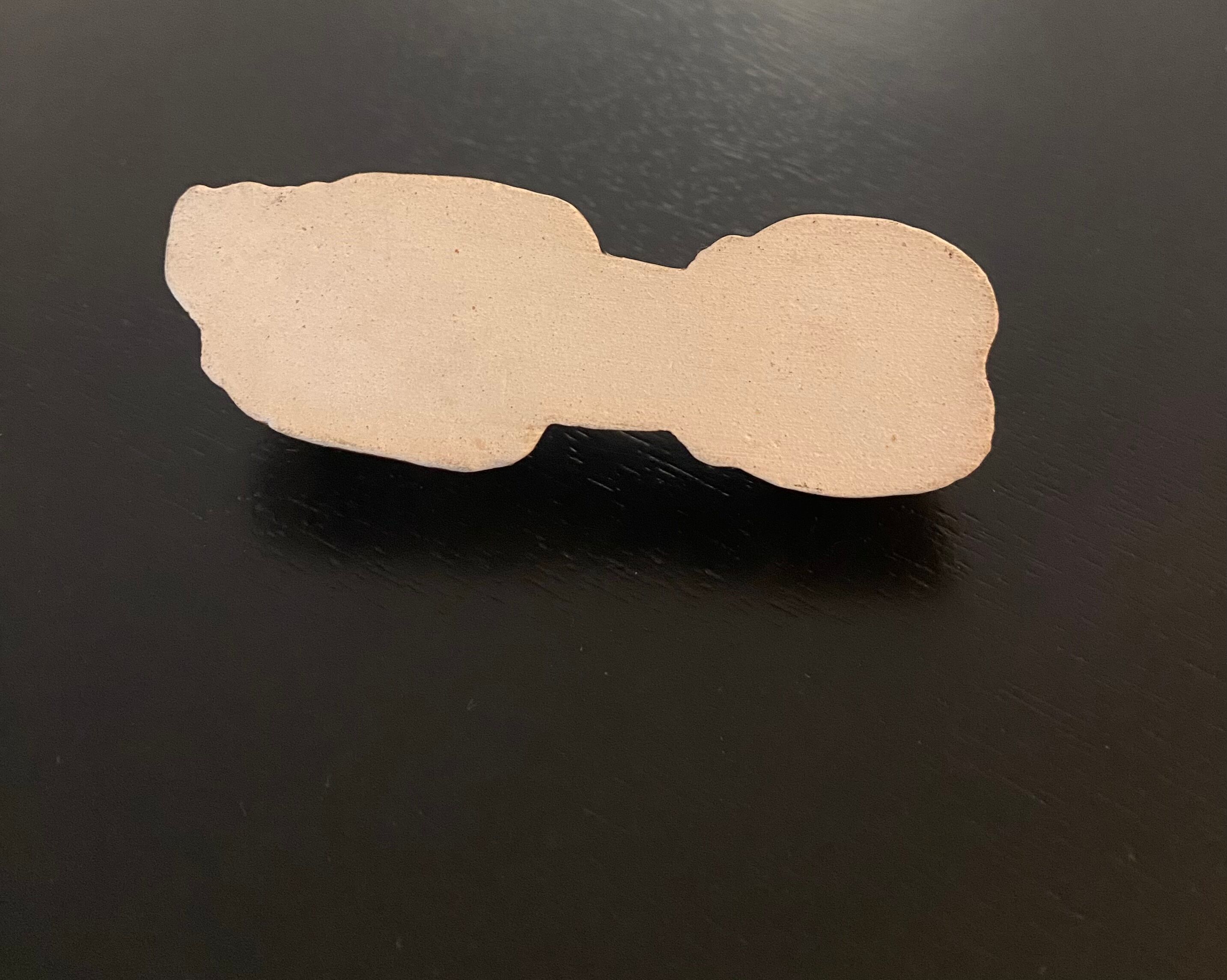 10 ceramic knife holders in the shape of a recumbent poodle