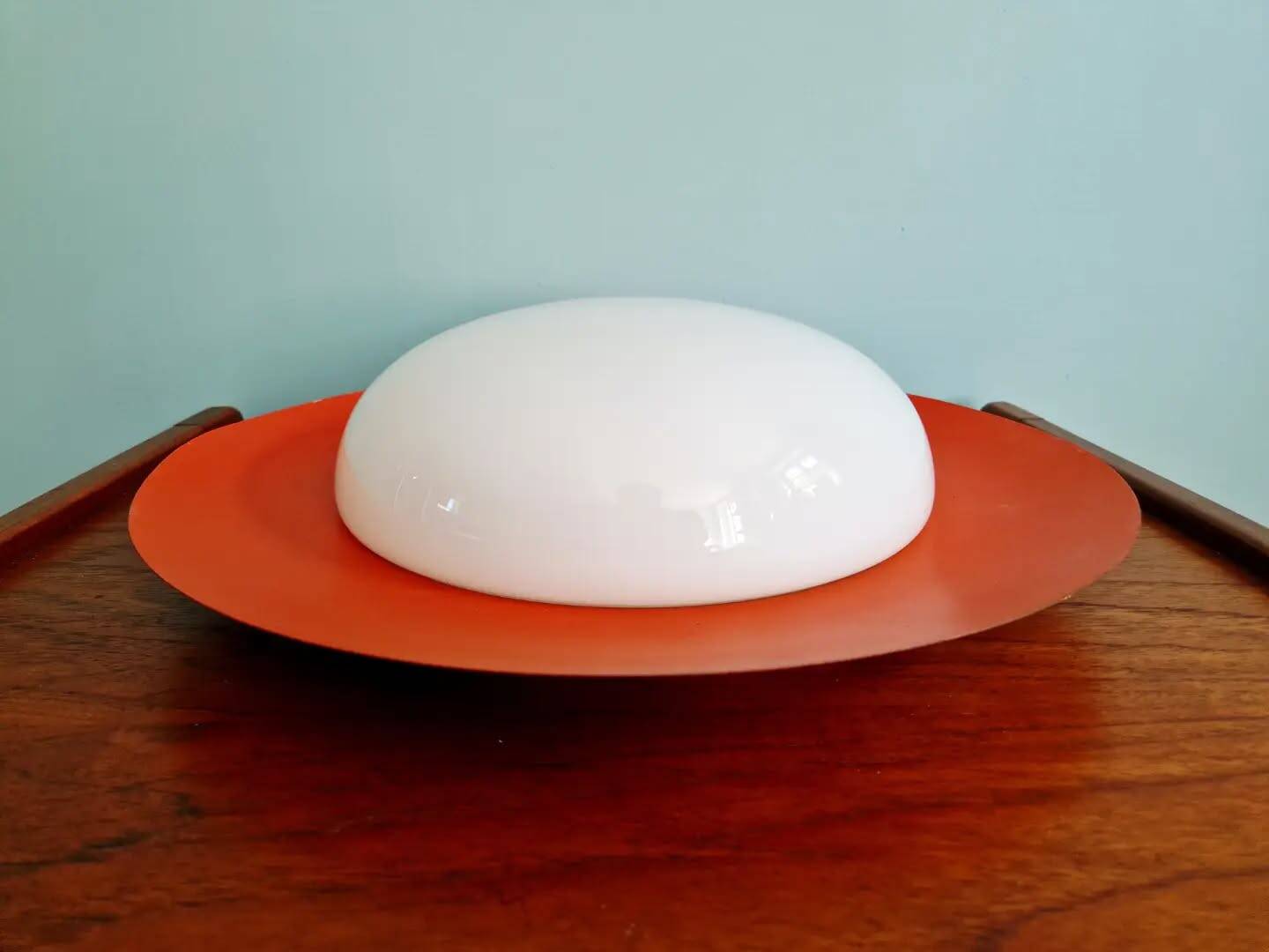 Pair of XXL Space Age wall sconces, orange lacquered metal and opaline, 1960.