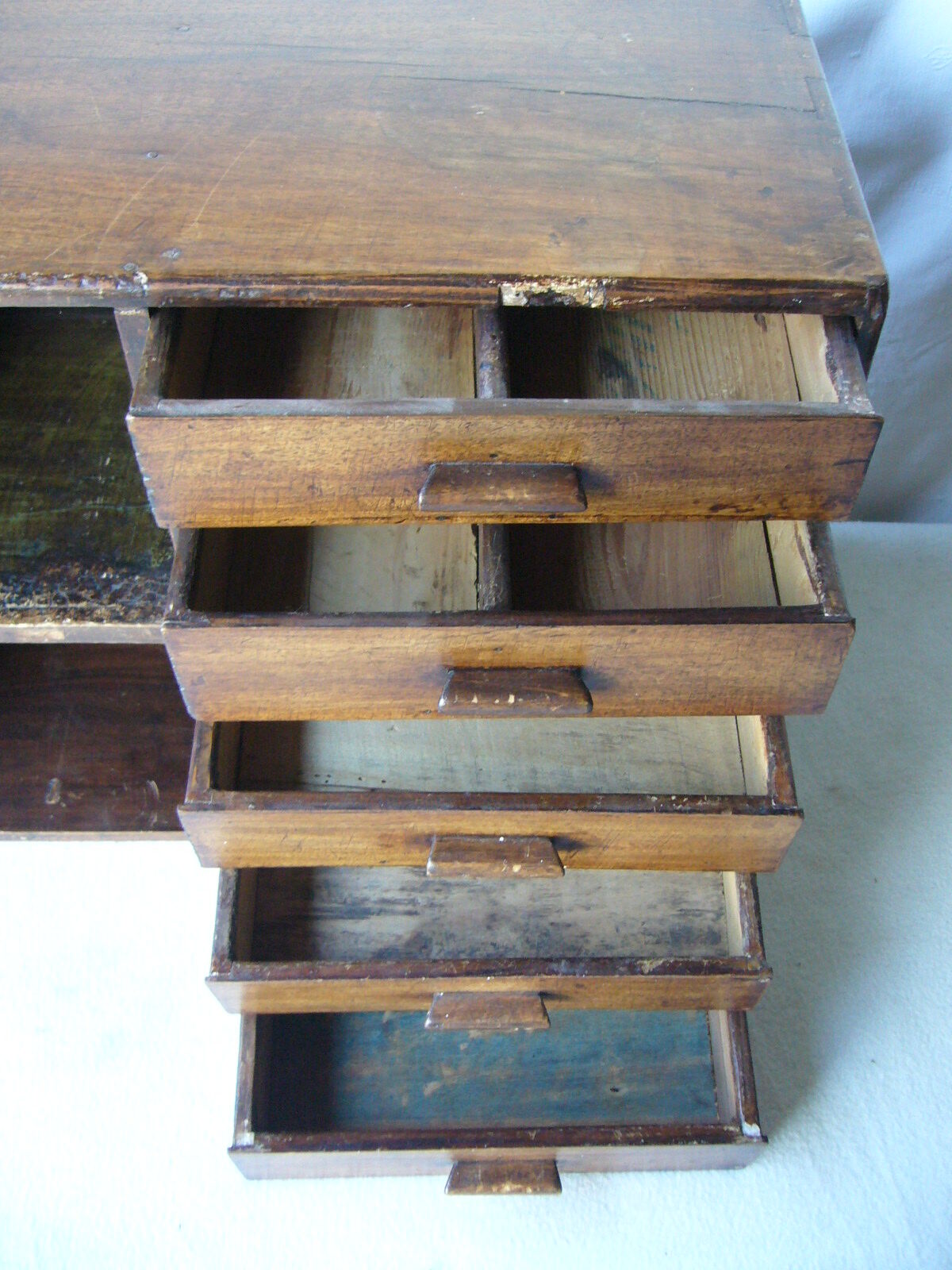 Antique, artisanal seven-drawer furniture