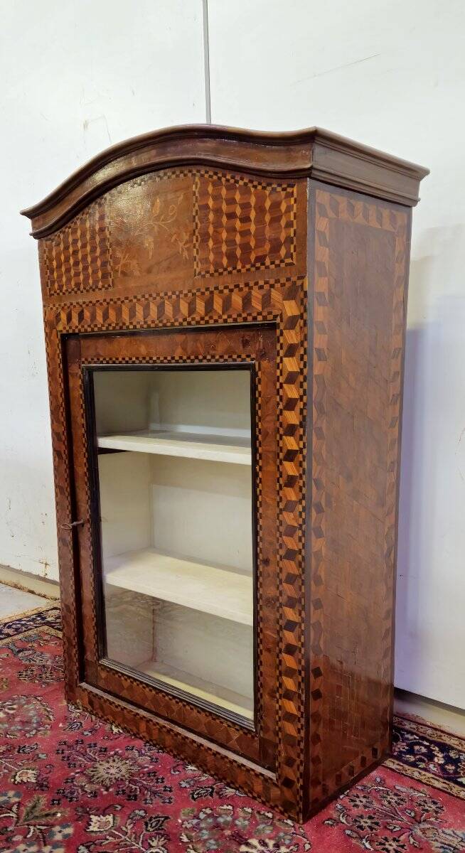 Antique Louis XV display cabinet with geometric marquetry decoration.