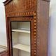 Antique Louis XV display cabinet with geometric marquetry decoration.