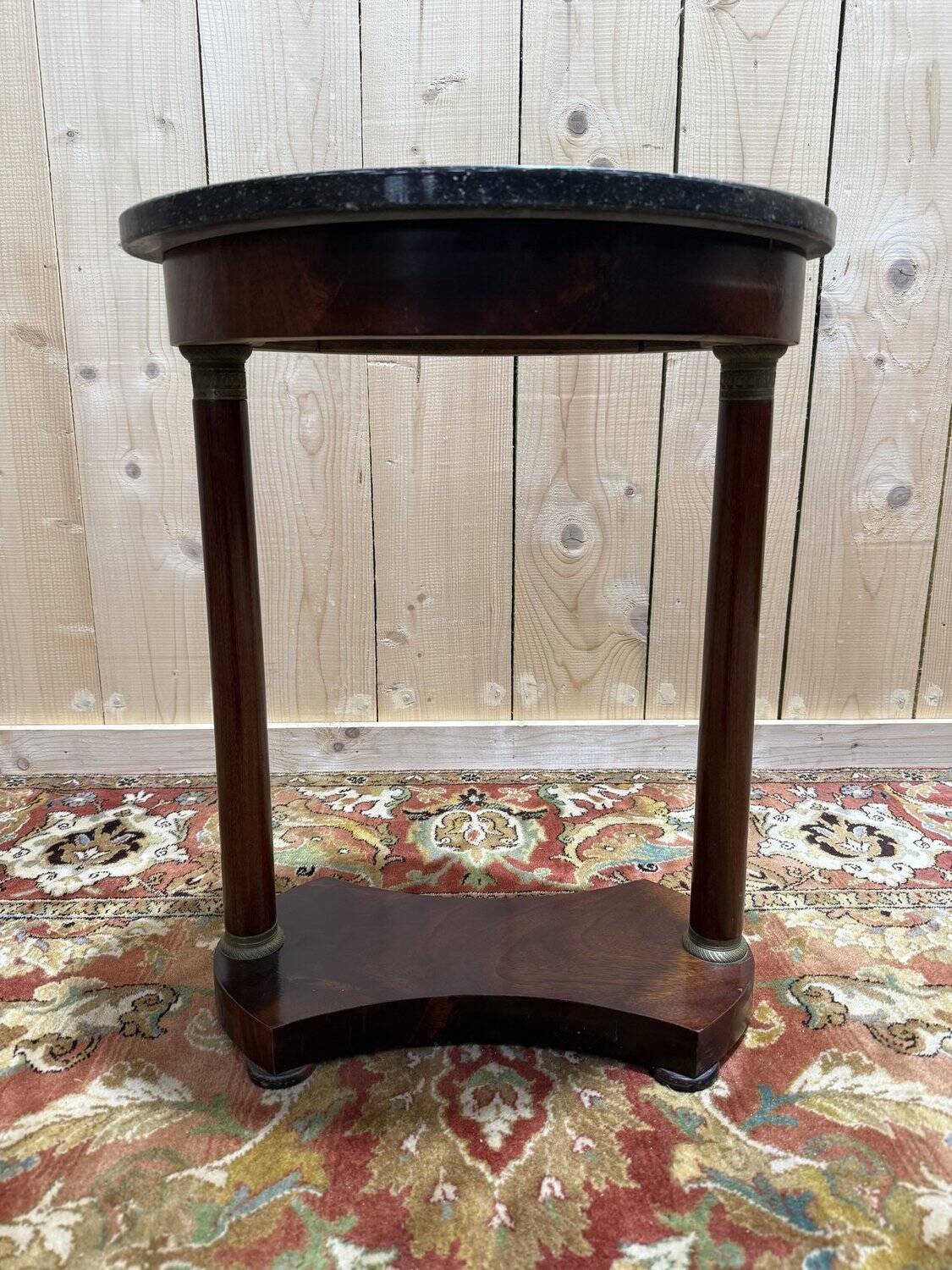 Small oval side table in Empire style