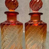 Pair of Baccarat twisted tinted crystal bottles