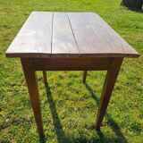Wooden table with a drawer