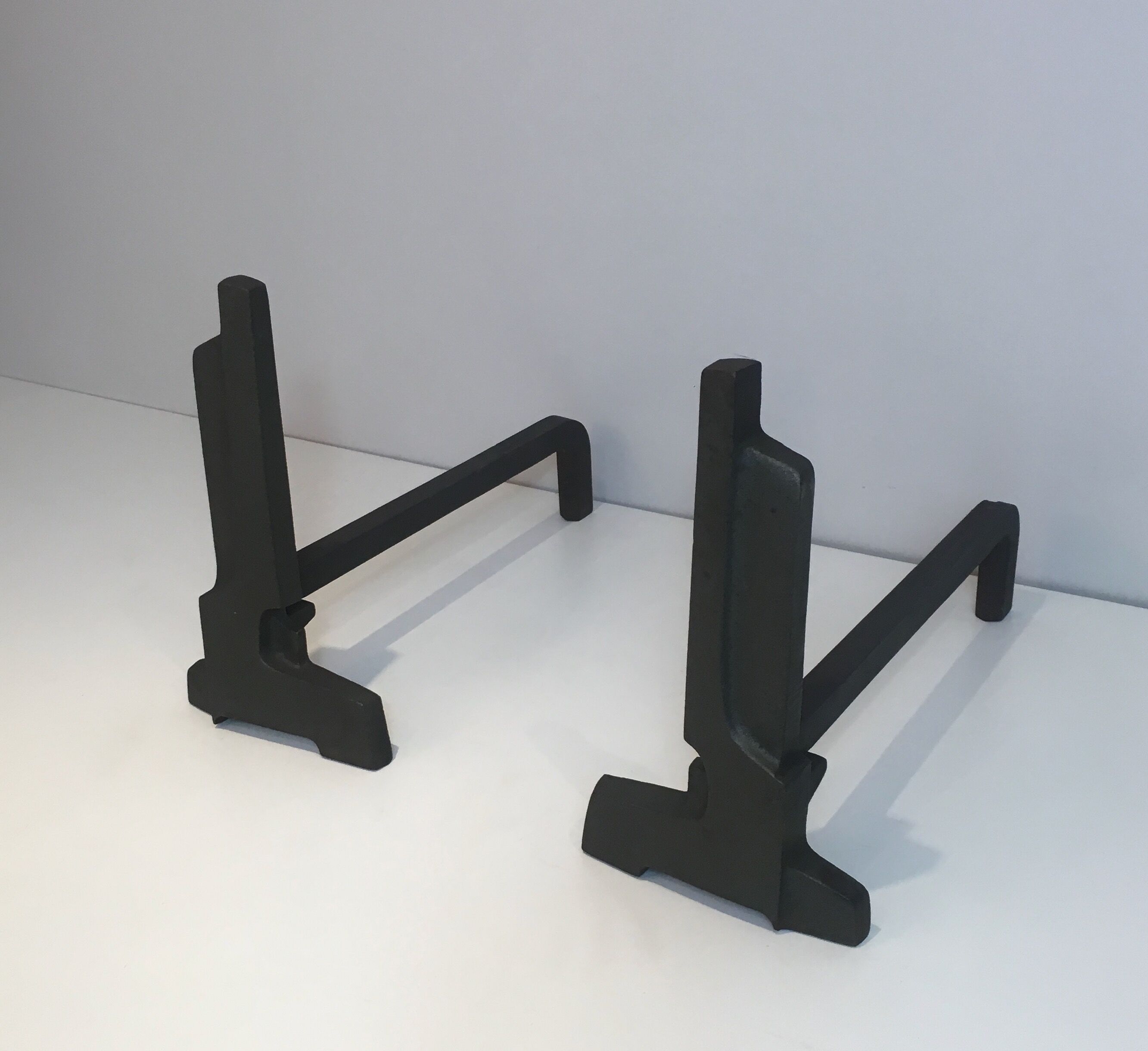 Pair of modernist chenets in cast iron and iron
