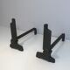 Pair of modernist chenets in cast iron and iron