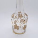 Old crystal carafe with golden decoration