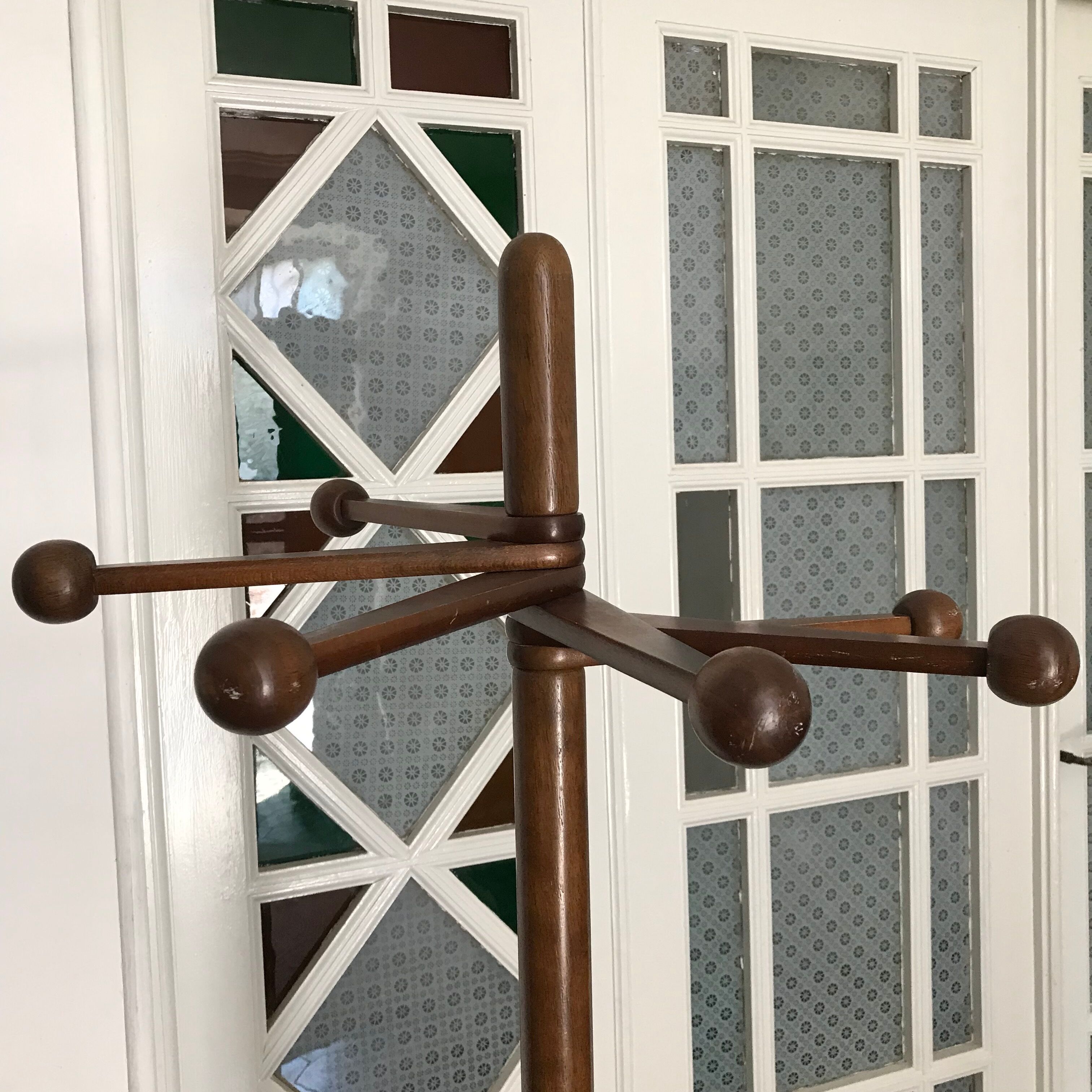 Wooden coat rack on foot