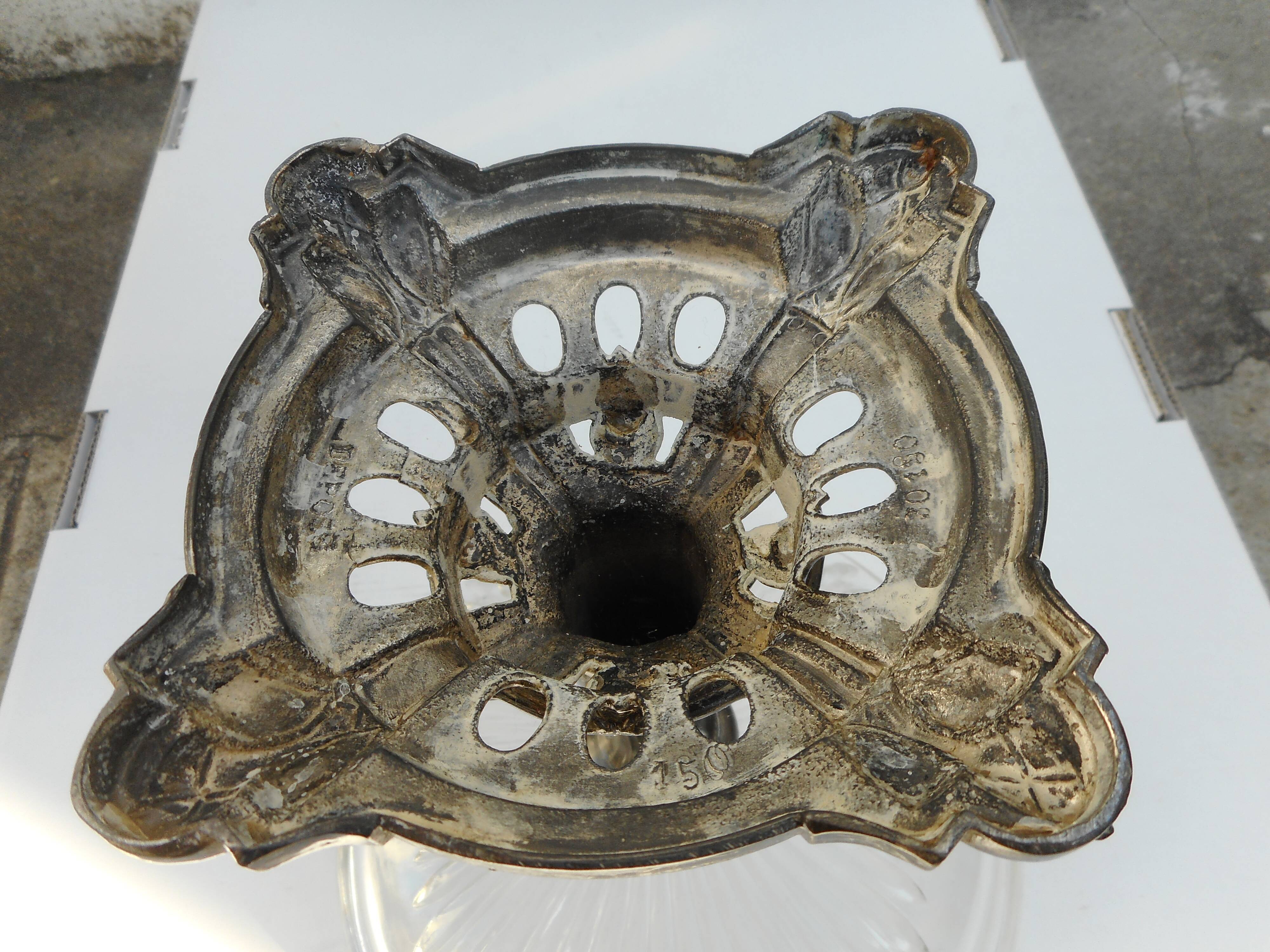 A glass cup on metal stand