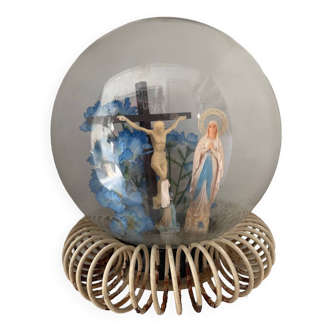 Beautiful globe with religious figures and flower composition
