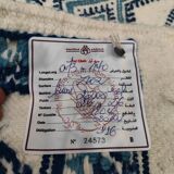 White and blue hand-woven rug in natural wool