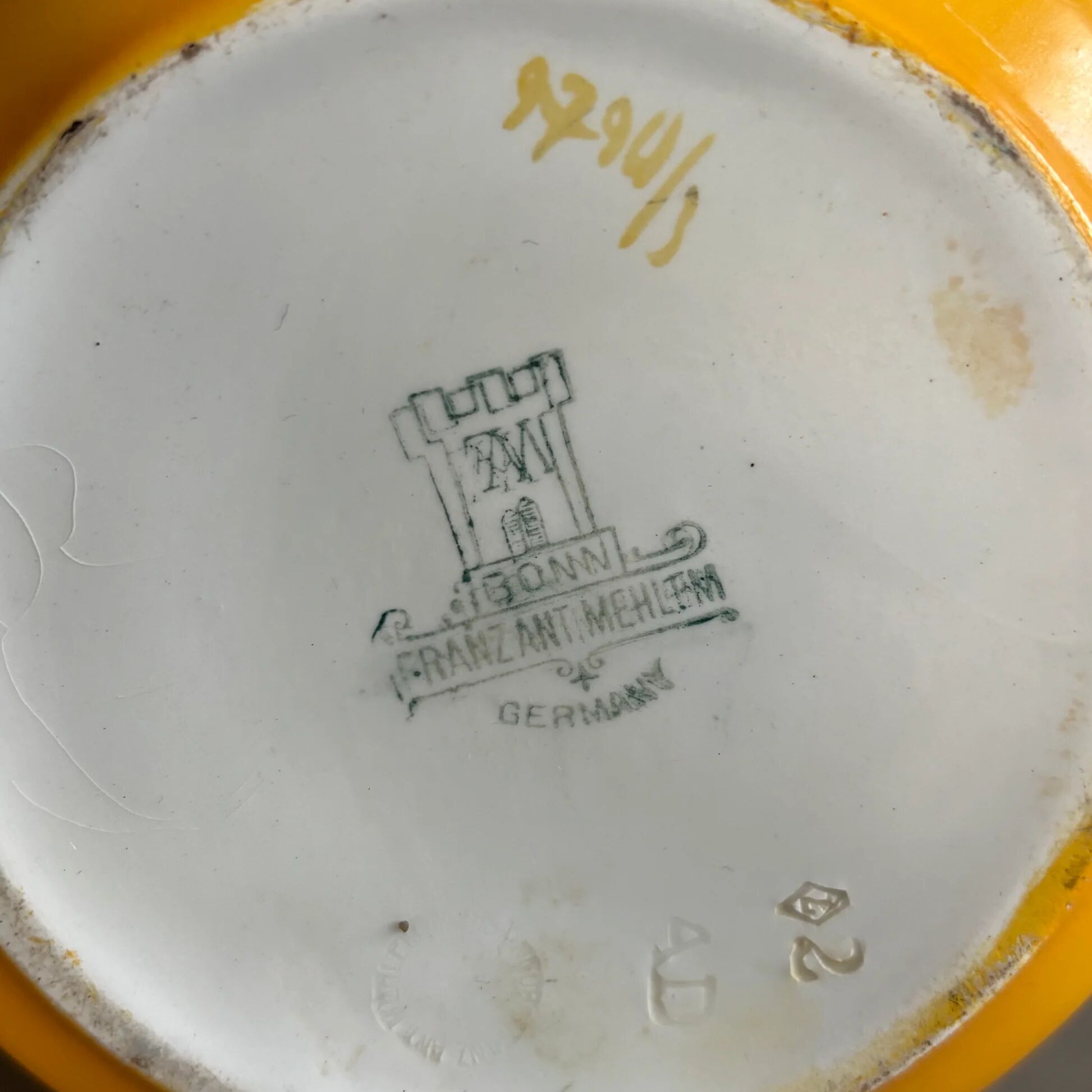 Antique teapot in earthenware with a tin filter lid.