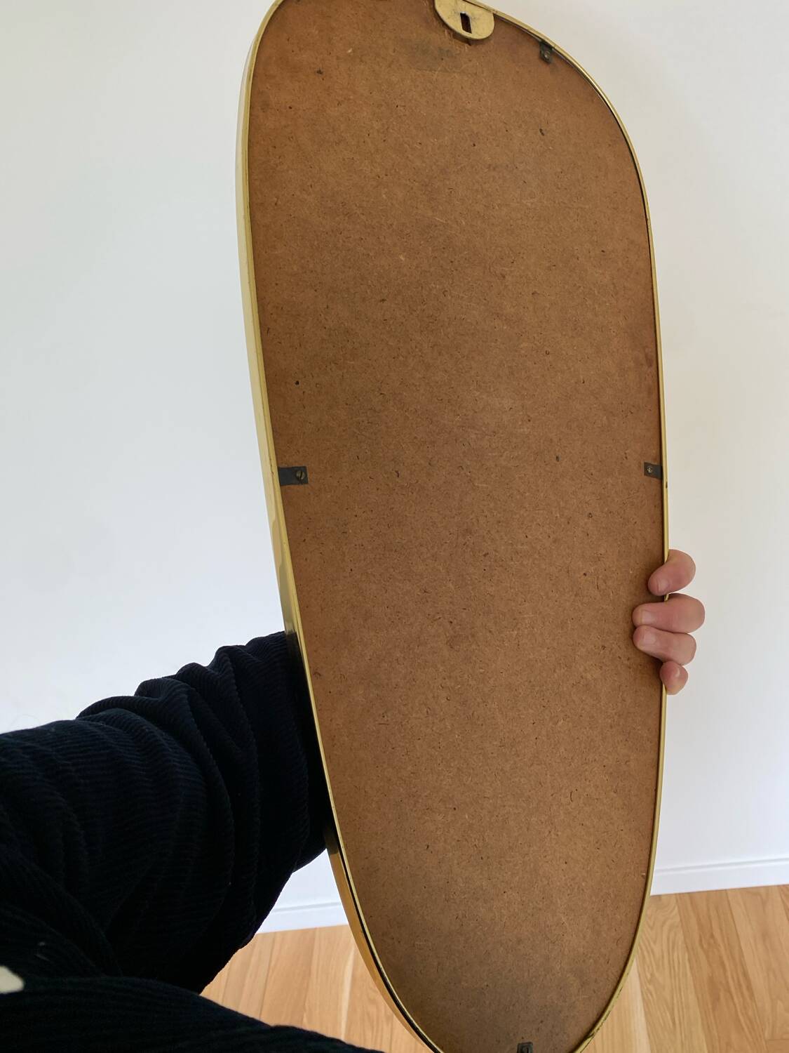 Vintage brass mirror in rear-view mirror shape