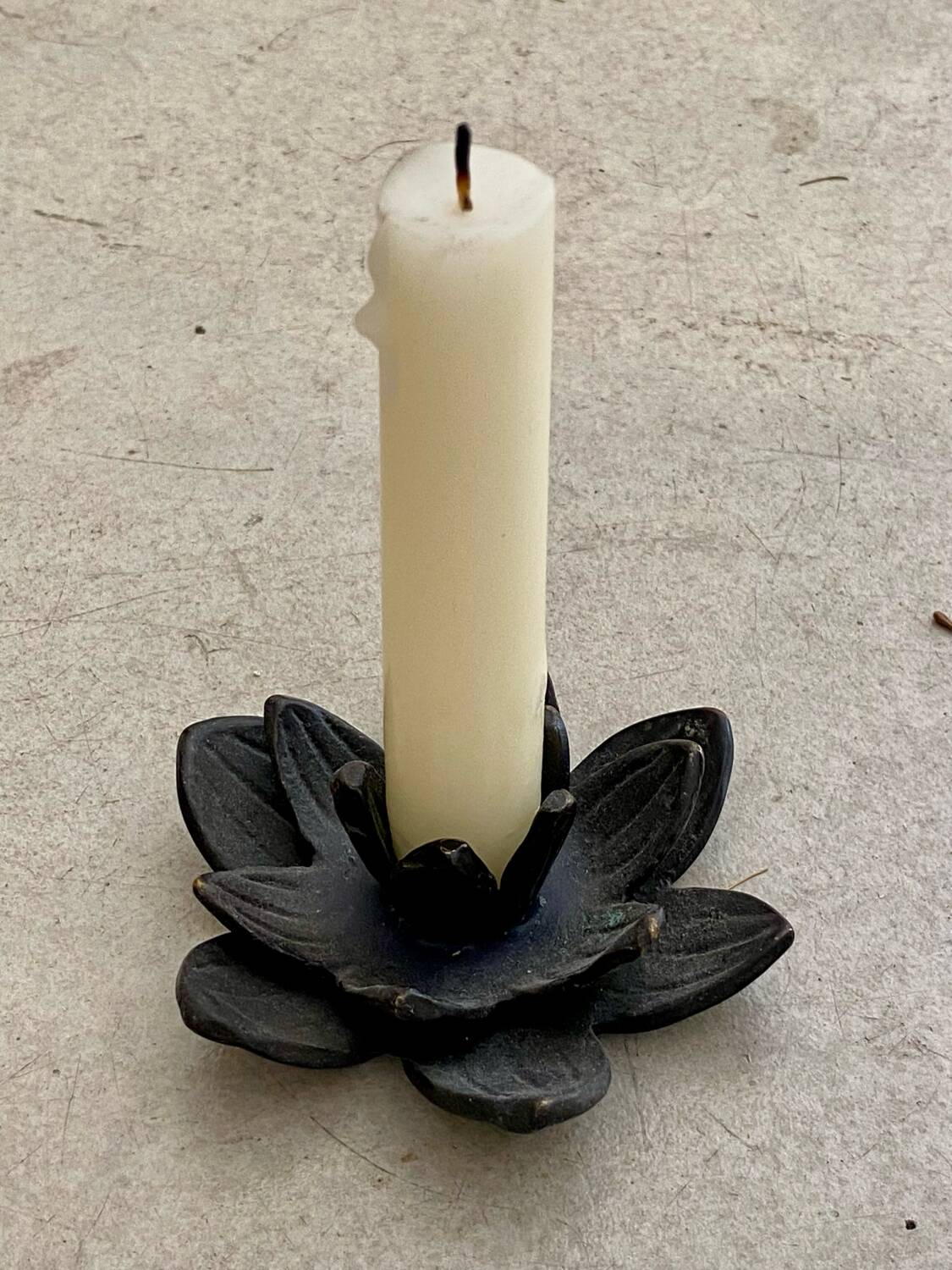Cast iron candle holder