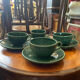 Set of 4 green ceramic coffee cups and plates