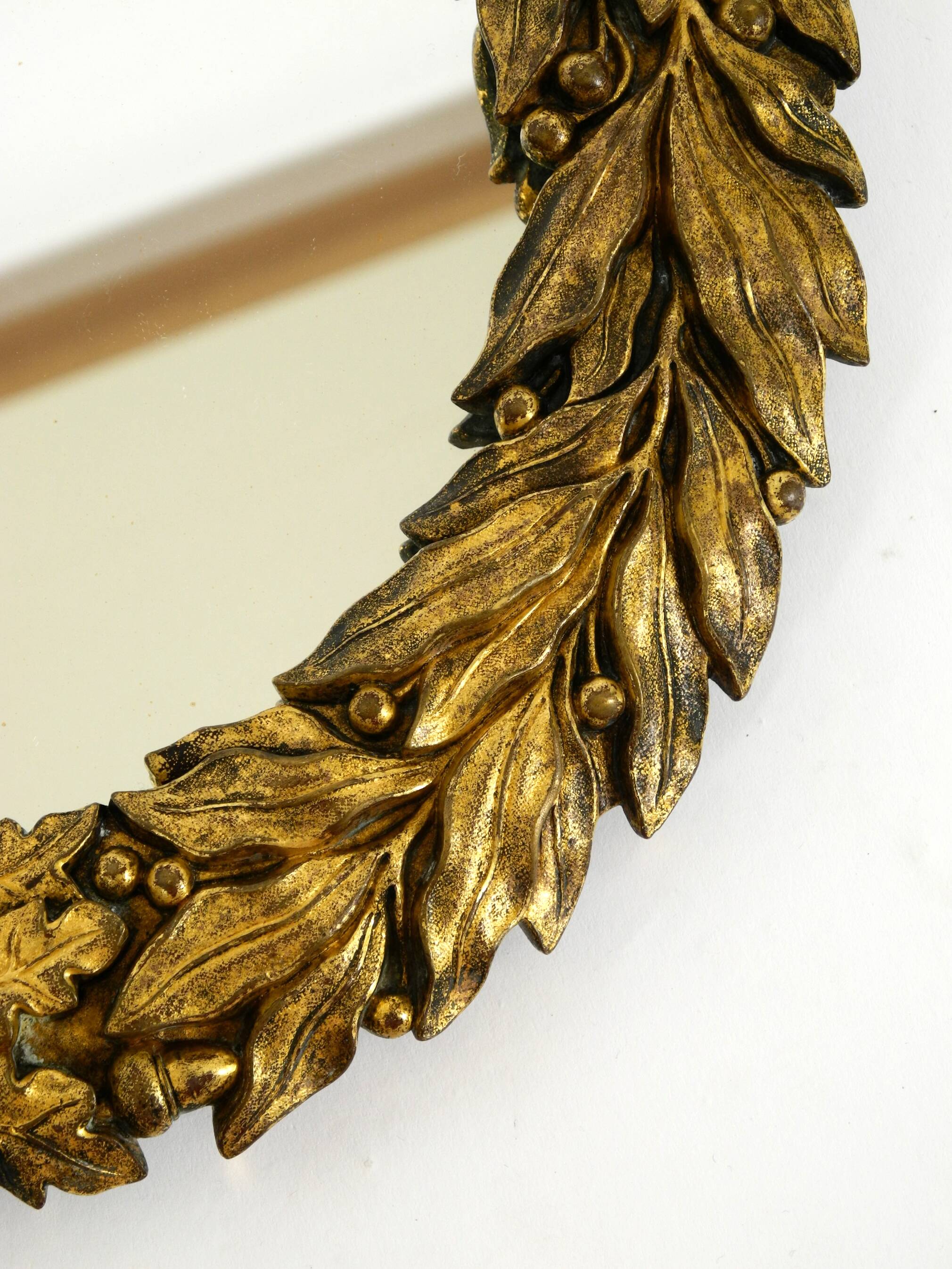 Beautiful small French mid-century wall mirror with an ornate brass frame