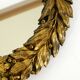 Beautiful small French mid-century wall mirror with an ornate brass frame