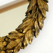 Beautiful small French mid-century wall mirror with an ornate brass frame