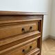 Antique wooden chest of drawers with three drawers.
