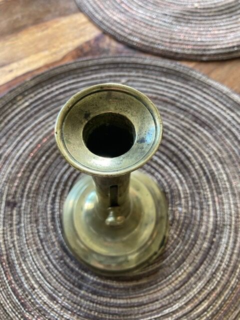 19th century brass candlestick says "to binet"