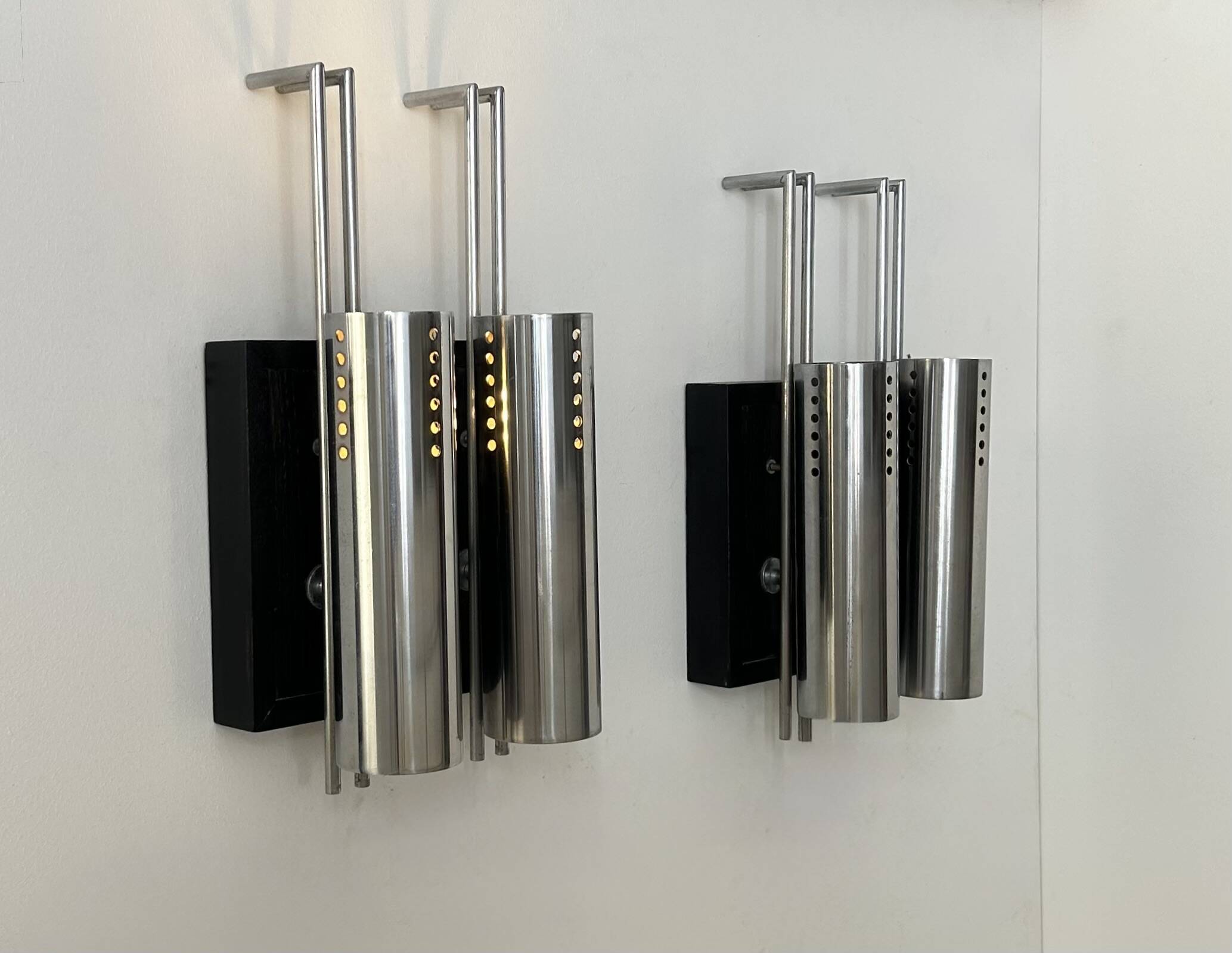 Pair of vintage wall lights, chrome-plated metal and blackened oak, France, 1970