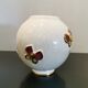 Vase boule "papillons" signé Longwy