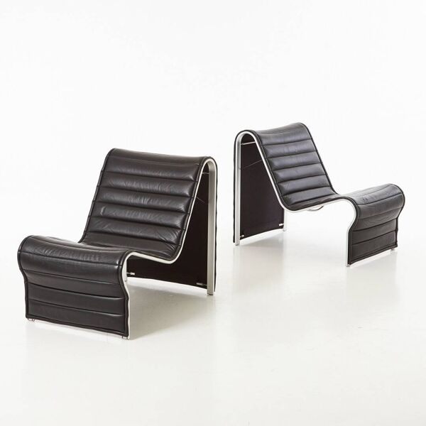 Modern black leather lounge chairs with an aluminium frame.