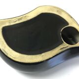 Empty pocket or ceramic ashtray in the shape of a shell