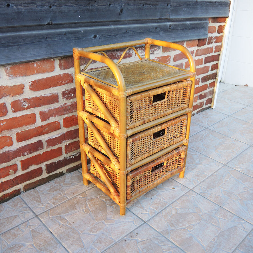 Old chest of drawers with 3 bamboo and wicker drawers.