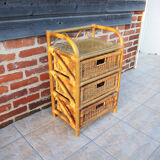 Old chest of drawers with 3 bamboo and wicker drawers.