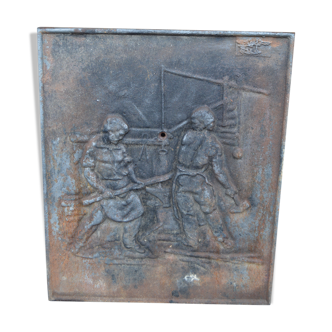 Cast iron chimney plate with blacksmiths