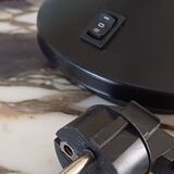 Articulated black and gold metal desk lamp