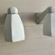 Pair of Art Deco wall sconces in ceramic and opaline.