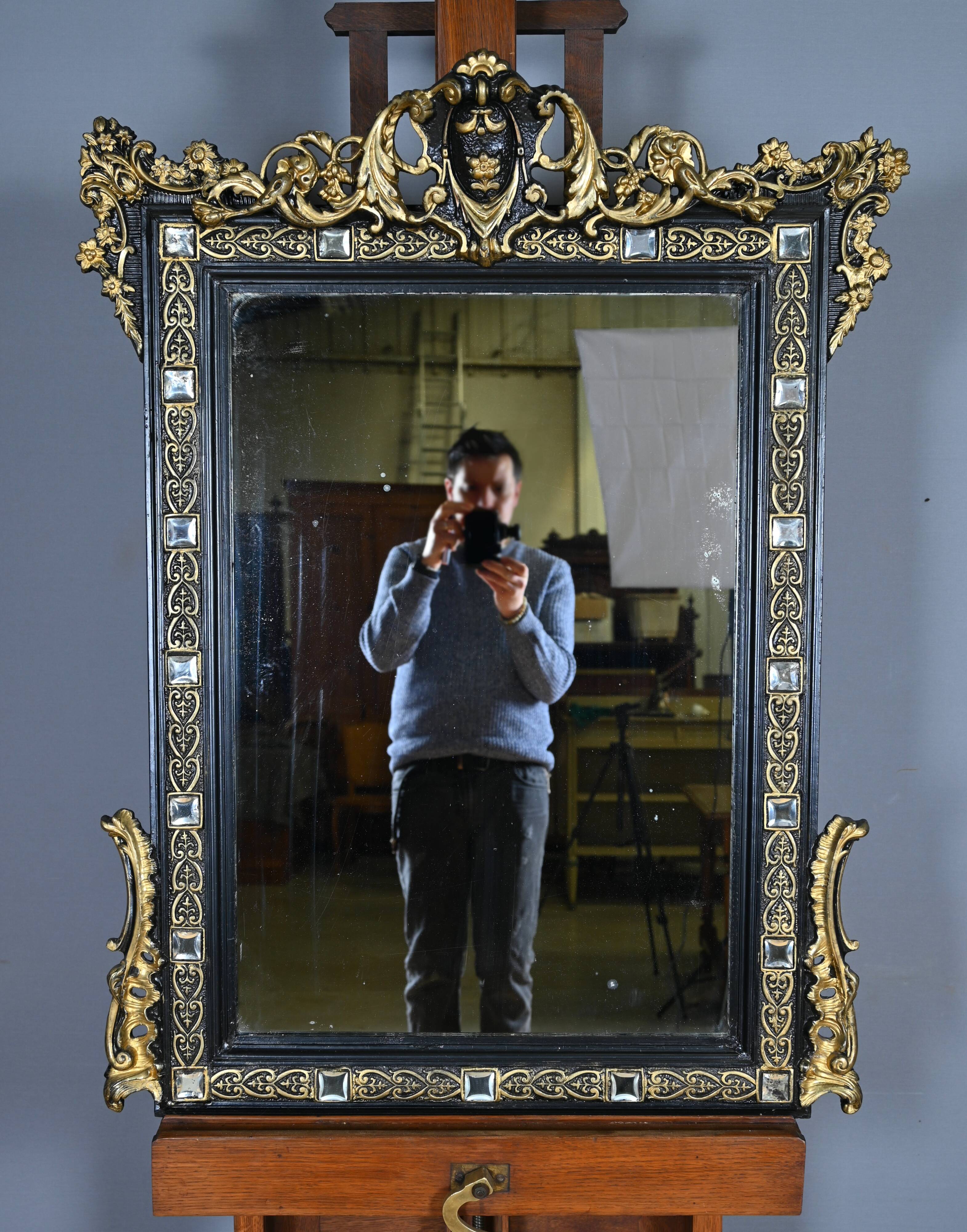 Black and gold Napoleon III mirror, 19th century, 115x86cm