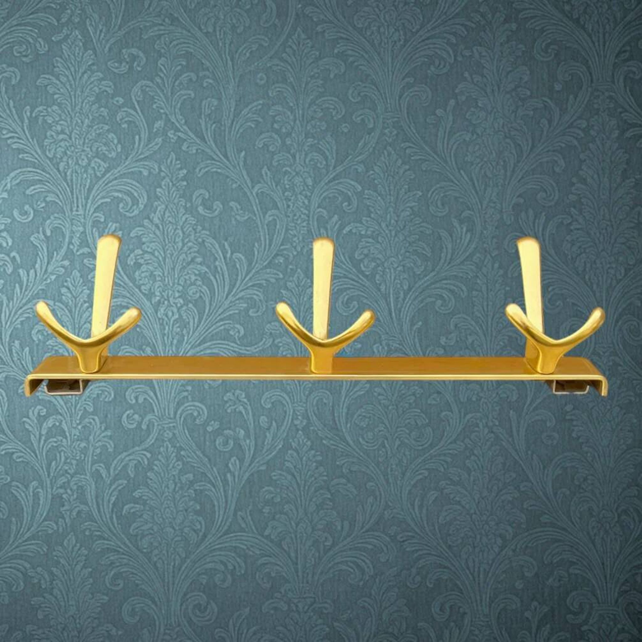 Vintage wall-mounted coat rack in anodised gold aluminium with 3 hooks from the 1970s.