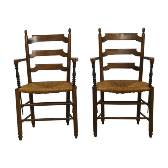 Pair of armchairs in solid oak and straw two-tone carved armrests.