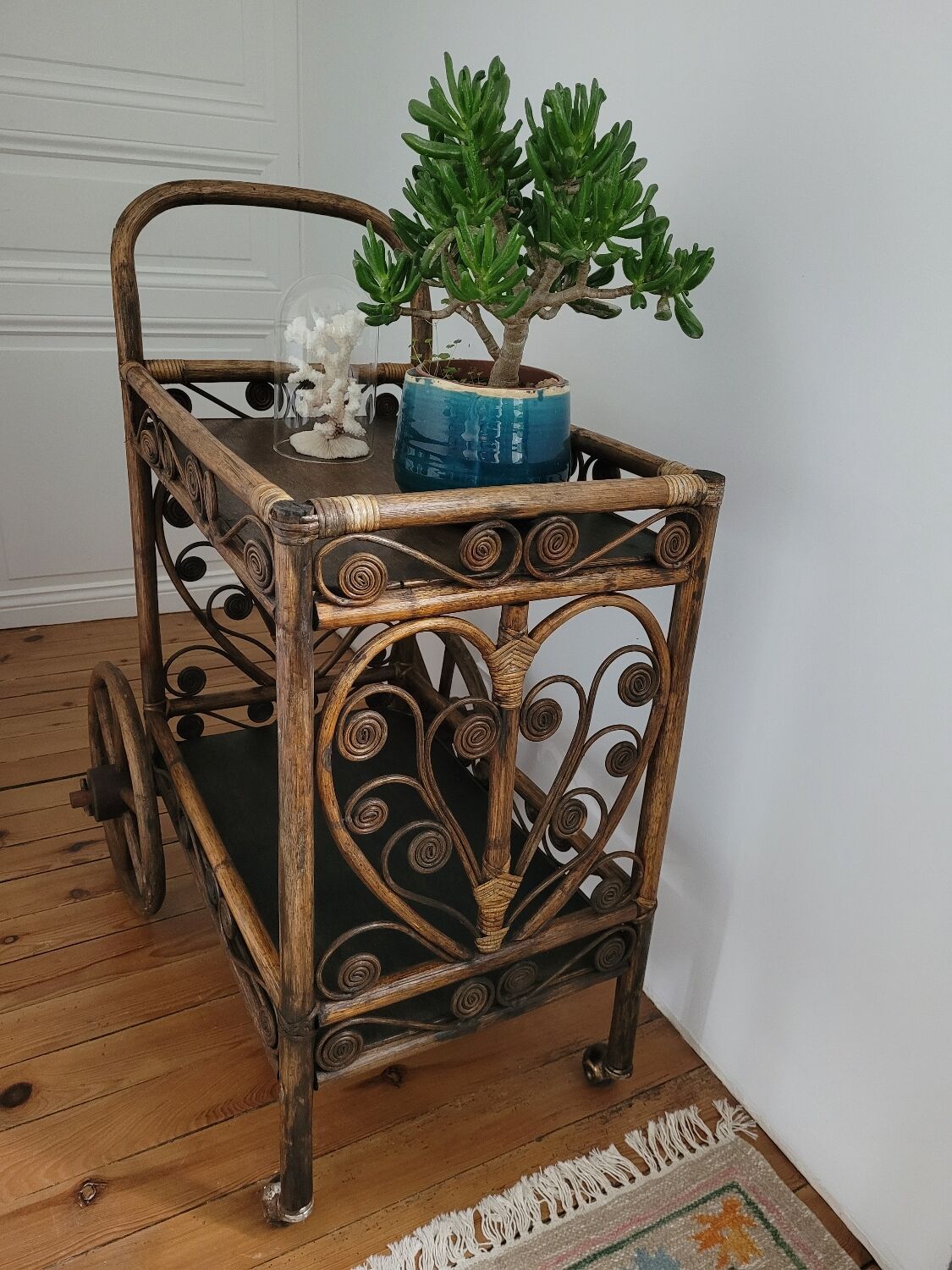 Bamboo and rattan dessert table in peacock style.