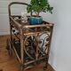 Bamboo and rattan dessert table in peacock style.