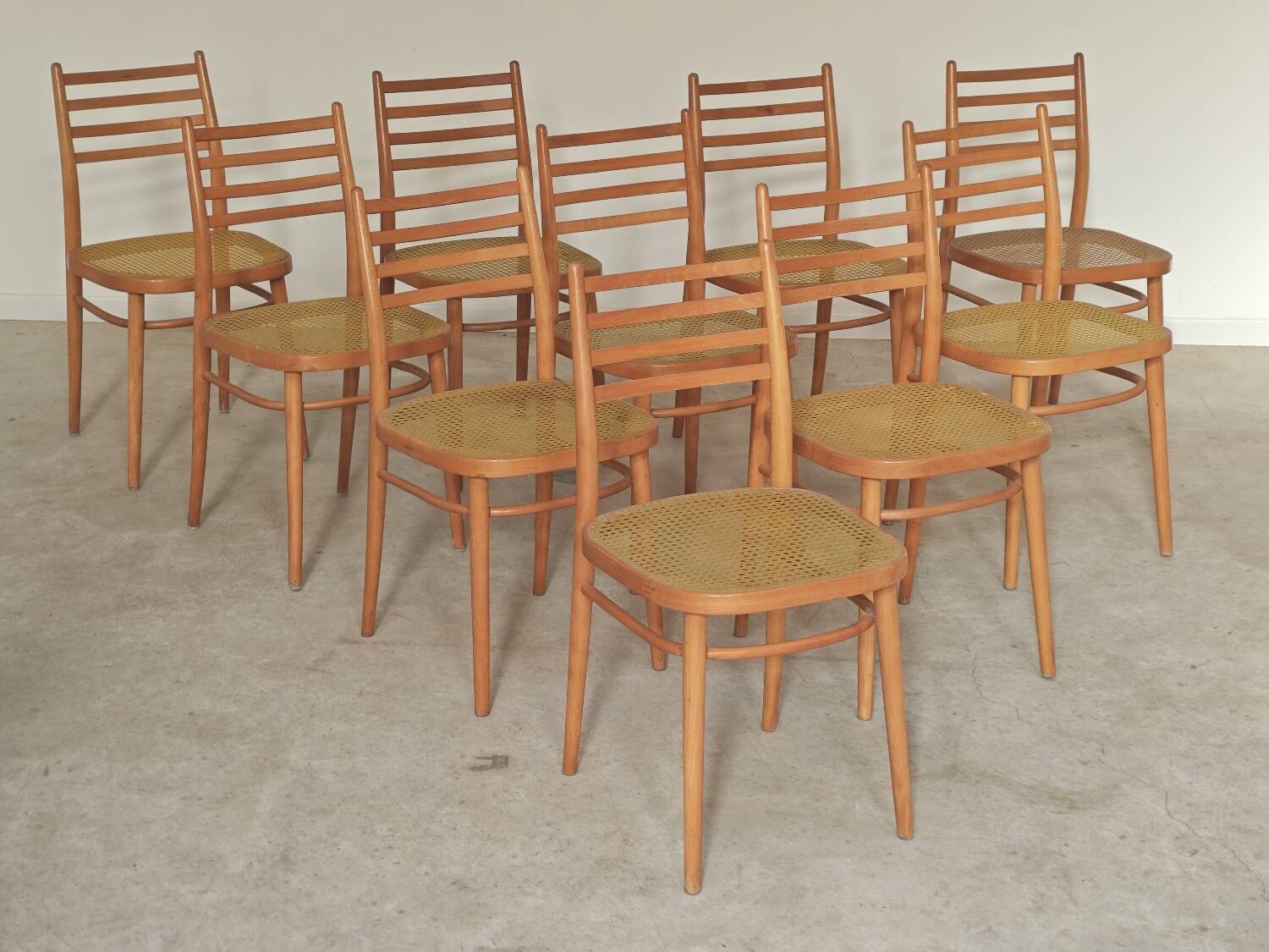 Set of 10 Bystrice tone wooden and caned chairs from the 1960s.