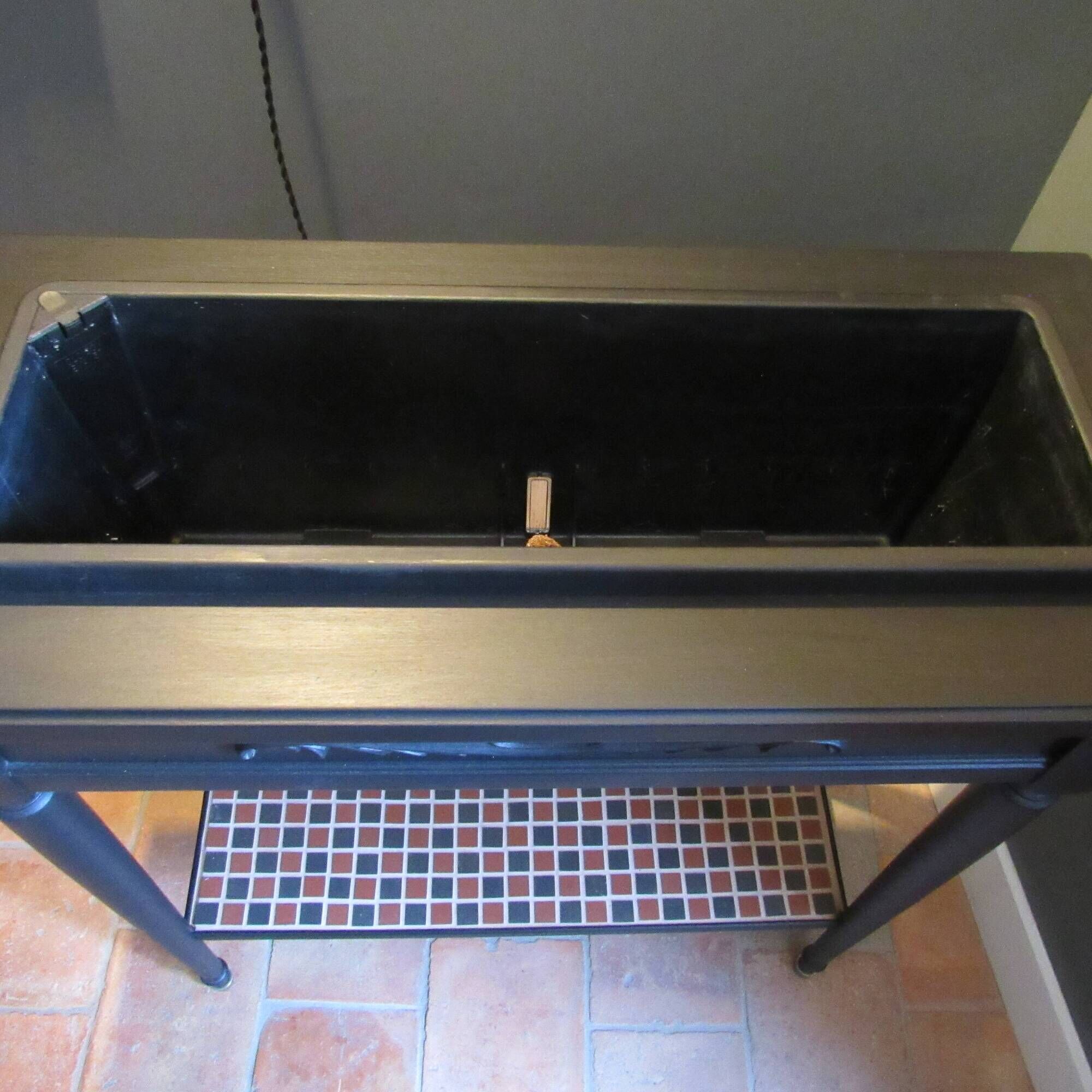 Vintage planter on wheels made of oak, repainted in black.