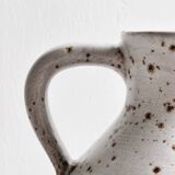 Pitcher, jar, jug in spotted stoneware.