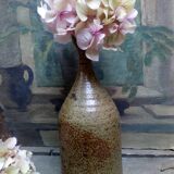 Bottled sandstone vase with a narrow neck