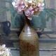 Bottled sandstone vase with a narrow neck