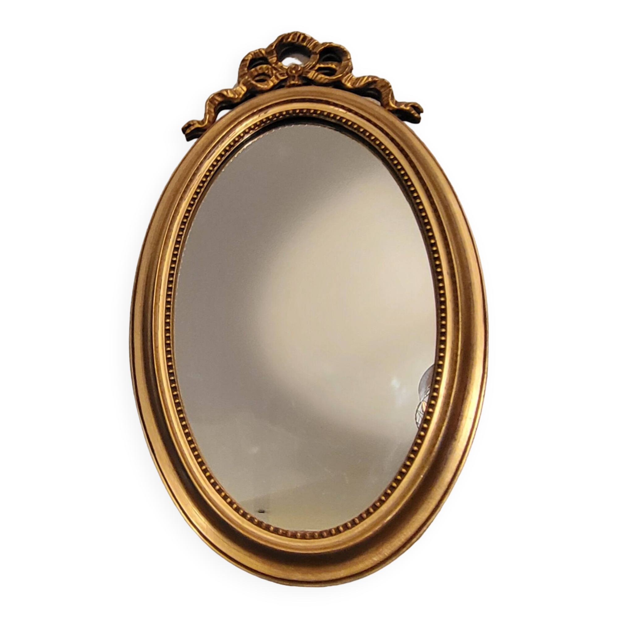 Oval mirror with golden wooden knot