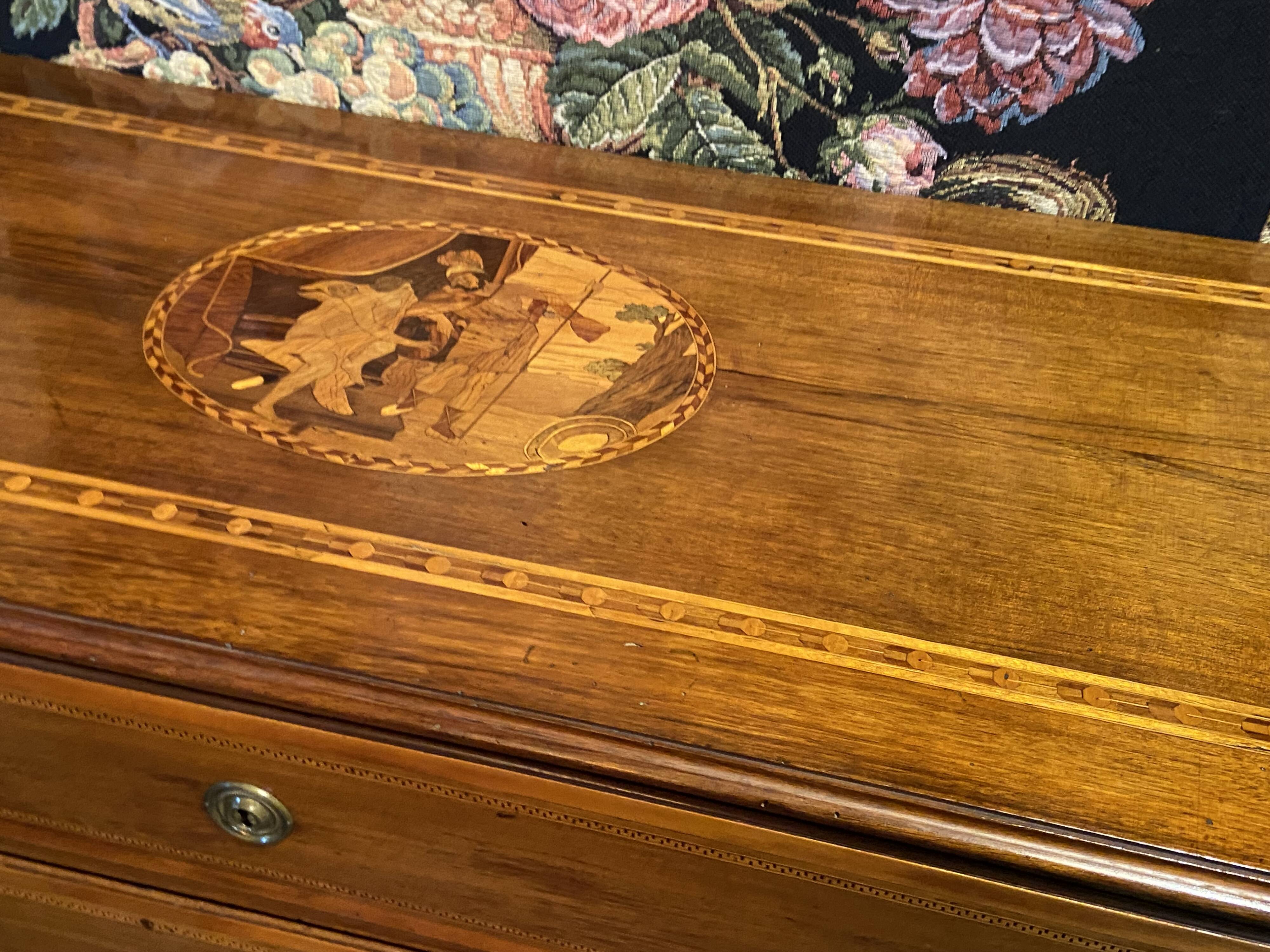 Large Louis XVI chest of drawers with 3 drawers, marquetry decoration depicting an antique scene from the late 18th century.
