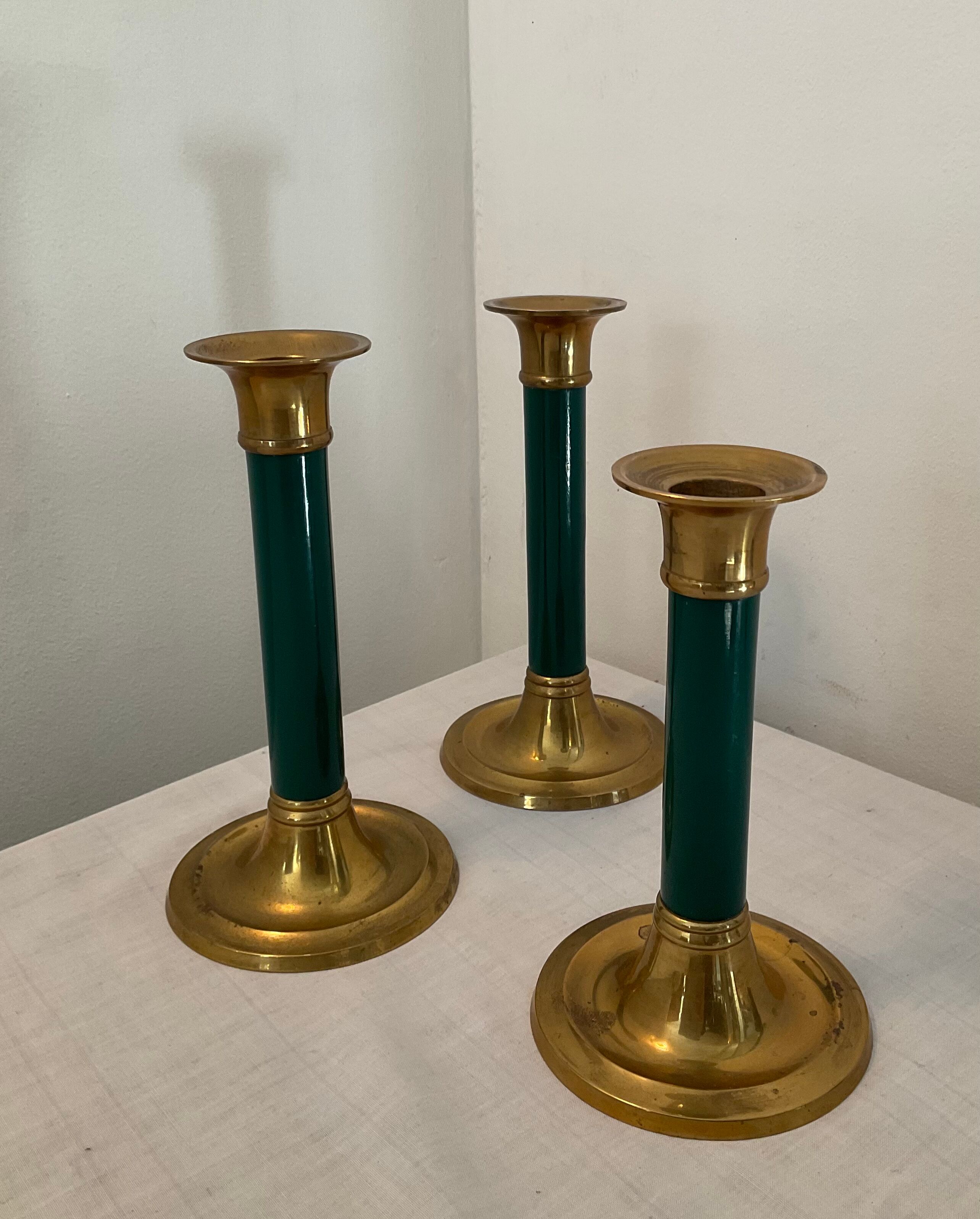 Trio of vintage bronze candle holders