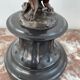 Candelabra with cherub in patinated bronze