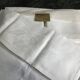 White damask table service consisting of a large tablecloth and 12 napkins